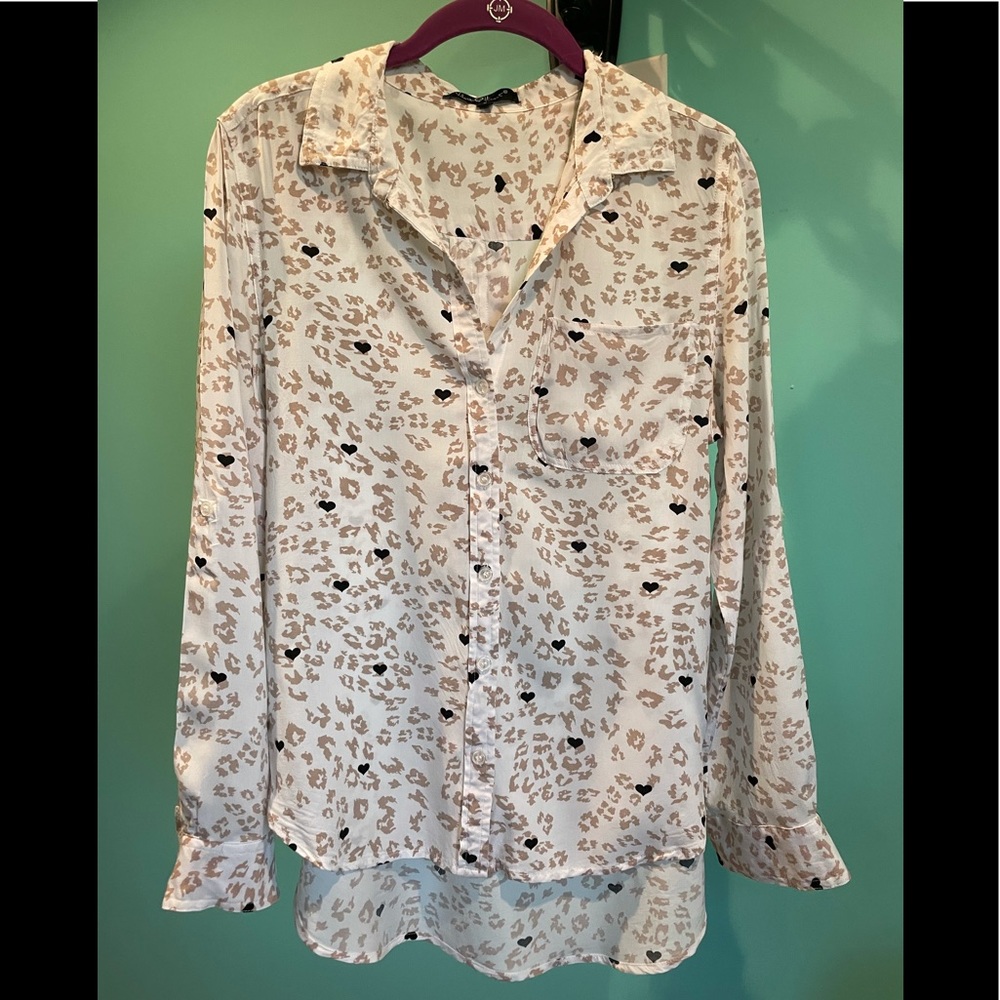 Women’s button down blouse. Can be worn over a tank.